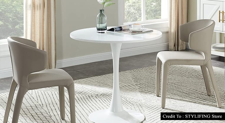 white round pedestal dining table