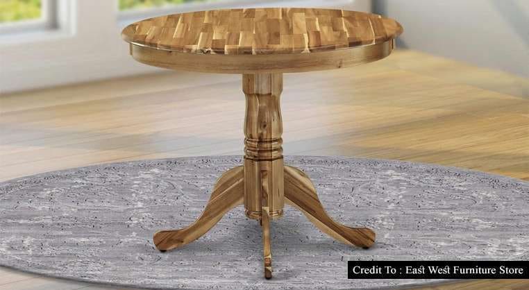 Natural wood round dining table